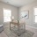 a bedroom with a chair and a table beaumont oaks at porters neck wilmington nc