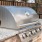 a grill on a brick wall
