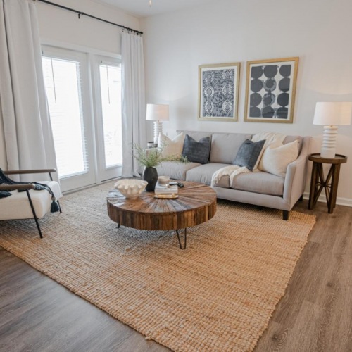 Wide open living areas perfect for entertaining a living room with a couch chair and a wood floor
