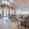 a large living room with chandeliers and a large rug beaumont oaks at porters neck wilmington nc