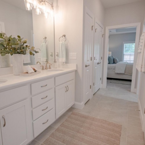 Bathroom options with thoughtful details a bathroom with white cabinets beaumont oaks at porters neck wilmington nc
