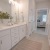 a bathroom with white cabinets beaumont oaks at porters neck wilmington nc