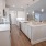 a kitchen with white cabinets