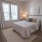 a bedroom with a large window