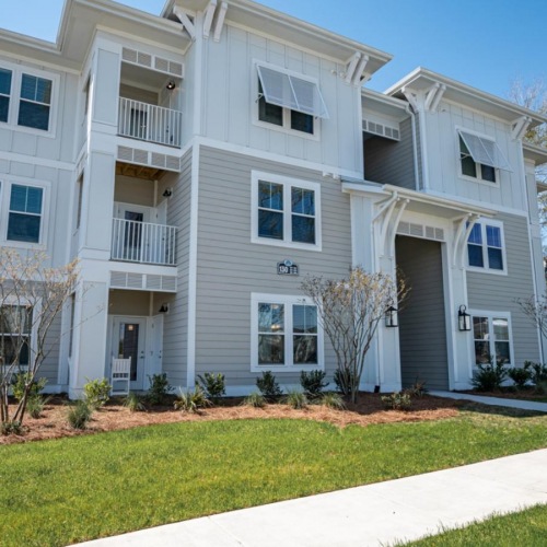 The essence of exceptional living a white building with a lawn