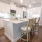 a kitchen with white cabinets