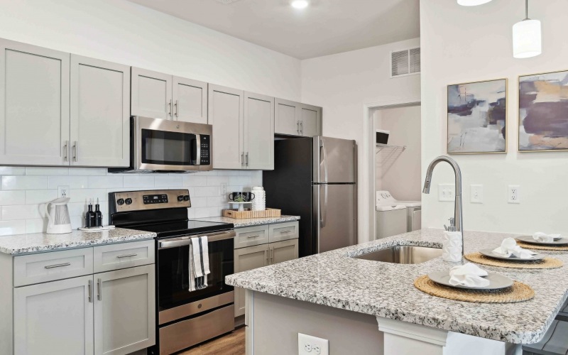 luxury kitchen with granite countertops and stainless steel appliances