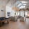 a large living room with a wood floor and a pool table