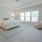 a bedroom with a bed and a couch beaumont oaks at porters neck wilmington nc